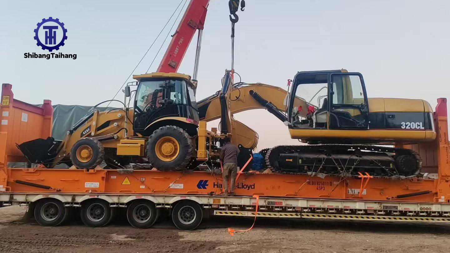 Caterpillar 420F and 320CL Loaded for Shipment via Flatbed Frame Transport